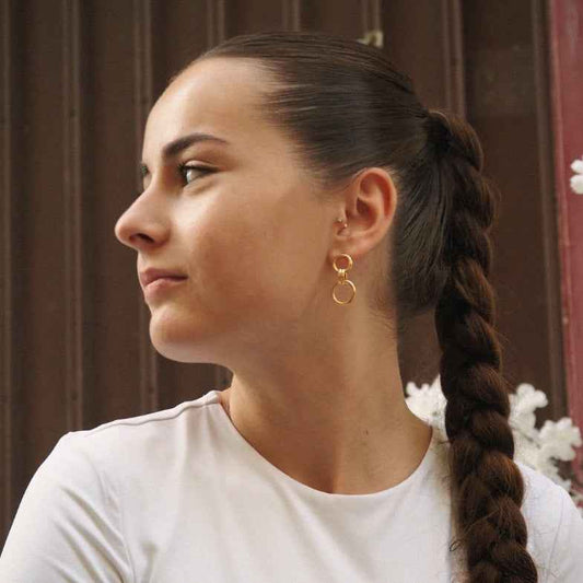 Boucles d’oreilles double feuille de ginkgo en acier PVD doré • Éléa