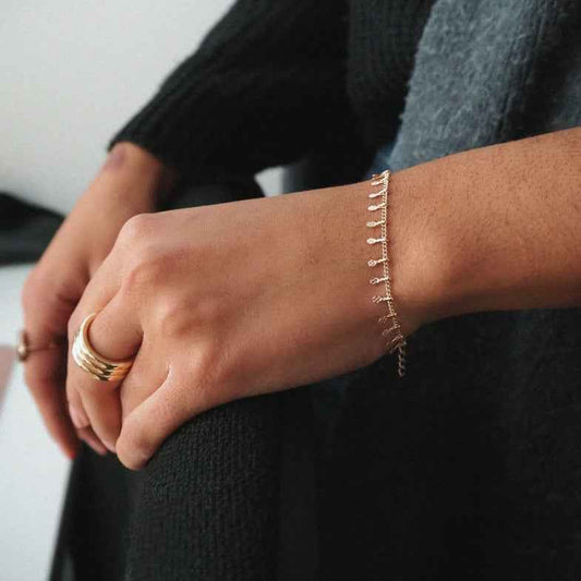 Bracelet doré à l'or 18 carats avec pampilles • Rufus